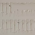 Various White Shower Heads And Fixtures Displayed On Wall 3d model
