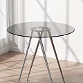 Modern Round Dining Table With Glass Top And Metal Legs On Wooden Floor