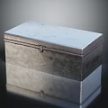 Silver Rectangular Metal Box With Lock Clasp On Smooth Reflective Surface
