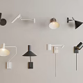 Various Black And White Wall Lamps With Different Shapes Mounted On Light Colored Wall 3d model