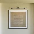 Wall Mounted Abstract Painting With Textural Pattern In Black Frame And Warm Interior Accents