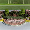 Roadside Traffic Island Landscaping With Trimmed Hedges And Colorful Flowers