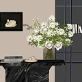 White Floral Arrangement In Glass Vase On Marble Table With Swan Painting And Books