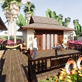 Beachfront Guesthouse Building With Wooden Deck Deck Chairs Large Windows Palm Trees And Ocean View