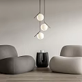 Rounded Leisure Sofa Set Dark Gray Light Beige On Wooden Floor With Hanging Spherical Lights