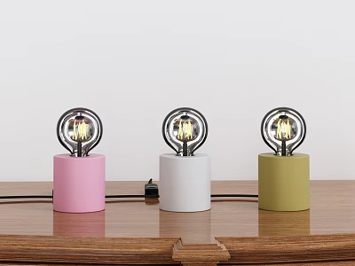 Three Decorative Lamps With Pink White Green Cylindrical Bases Metal Ring Frames Exposed Bulbs 3d model