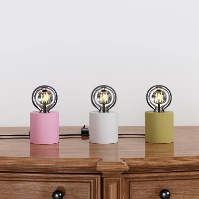 Three Decorative Lamps With Pink White Green Cylindrical Bases Metal Ring Frames Exposed Bulbs 3d model