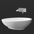 Modern White Ceramic Countertop Washbasin With Sleek Wall Mounted Faucet Design