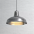 Modern Silver Metal Pendant Light With Dome Shade And Warm Glow Over White Brick Wall