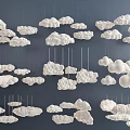 Multiple Decorative White Cloud Shaped Chandeliers Hanging From Dark Ceiling 3d model