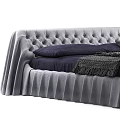 Modern Tufted Bed With Pleated Skirt And Navy Bedding