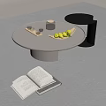 Modern Round Light Colored Coffee Table With Open Book Plate Of Green Fruits