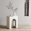 Modern White Side Table With Vase Green Leaves And Books On Arched Shelf