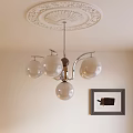 Modern Glass Globe Chandelier with Metal Frame and Ceiling Medallion in Interior with Wall Art