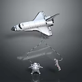 Space Shuttle Model With Astronaut Figures Hanging On Strings Against Gray Background