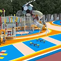 Kindergarten Playground With Colorful Floor Sun Pattern Slide And Football Structure