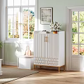 White Modern Shoe Cabinet With Golden Legs And Geometric Design In Bright Living Room