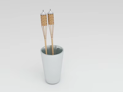 Two Decorative Wicker Covered Wooden Sticks Standing Vertically in White Ceramic Cup 3d model