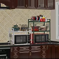 Practical Kitchen Counter With Microwave Top Shelf Holding Pots Dishes Cups And Spice Jars