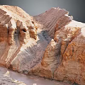 Natural Rugged Canyon Formation With Reddish Brown Layered Rock Cliffs And Erosion Gullies