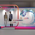 Contemporary Exhibition Hall With People Moving Around Decorative Flower Booths And Display Panels