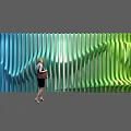 Large Scale Art Installation With Vertical Strips And Blue To Green Gradient Wavy Design