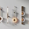 Modern Wall Sconces With Gold Finish Glass Shades And Geometric Design On White Wall