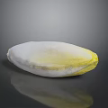 Fresh Endive Vegetable With White Base And Yellow Leaf Tips On Dark Background