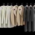 Stylish White Beige Gray Long Coats Hanging Neatly on Hangers
