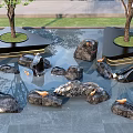 Garden Ornaments Featuring Circular Tree Islands Water Pond Rocks and Lawn on Stone Slabs