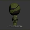 Green Character Model With Orange Visor And Green Armor On Base Stand