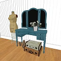Blue Vanity With Triple Mirror Flower Vase Mannequin And Vintage Suitcase On Wooden Floor
