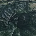 Aerial Planning of Natural Mountain Terrain With Winding Paths and Green Vegetation