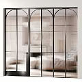 Modern Glass Sliding Doors with Black Frames Vertical Stripes and Round Accents for Interior Partition