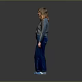 Woman Standing Against Gray Background Wearing Gray Long Sleeve Top Blue Jeans And Blue Shoes