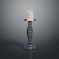 Lit Beige Candle On Decorative Braided Metal Candlestick Stand With Smooth Base
