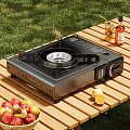 Portable Gas Stove For Outdoor Cooking On Wooden Table With Fresh Fruits And Beverages