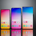 Three Modern Smartphones With Colorful Bright Screens And App Icons