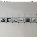 Metal Wall Photo Frames with Black and White Architectural Photos Neatly Arranged
