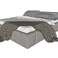 Modern Gray Upholstered Double Bed With Gray Pillows White Sheets And Plaid Blanket