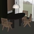Oval Black Wooden Dining Table And Wicker Back Chairs Near Window With Pendant Light