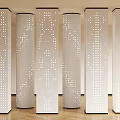 White Perforated Columns Arranged In Interior Space With Light Background And Wooden Floor