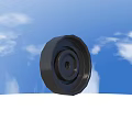 Black Tire Front View Against Blue Sky With White Clouds Outdoor Scene