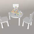 Kids Table with Three White Chairs and Colorful Building Blocks Toys on Top
