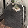 Modern Black Bedside Cabinet with Multiple Curved Drawers and Decorative Vase Books on Top