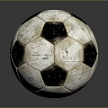 Vintage Black And White Soccer Ball With Worn Texture On Dark Reflective Surface