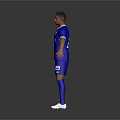 Man in blue sports uniform with EMAAR logo and number 2 standing with arms outstretched