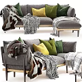 Gray Sofa With Green Yellow Pillows And Plaid Fur Blankets On Wooden Legs