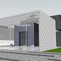 Modern Architectural Exterior Featuring Glass Facade Geometric Wall Entrance Area And Green Lawn