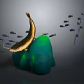 Golden Fish With Long Whiskers Swimming Around Green Rock And Small Fish